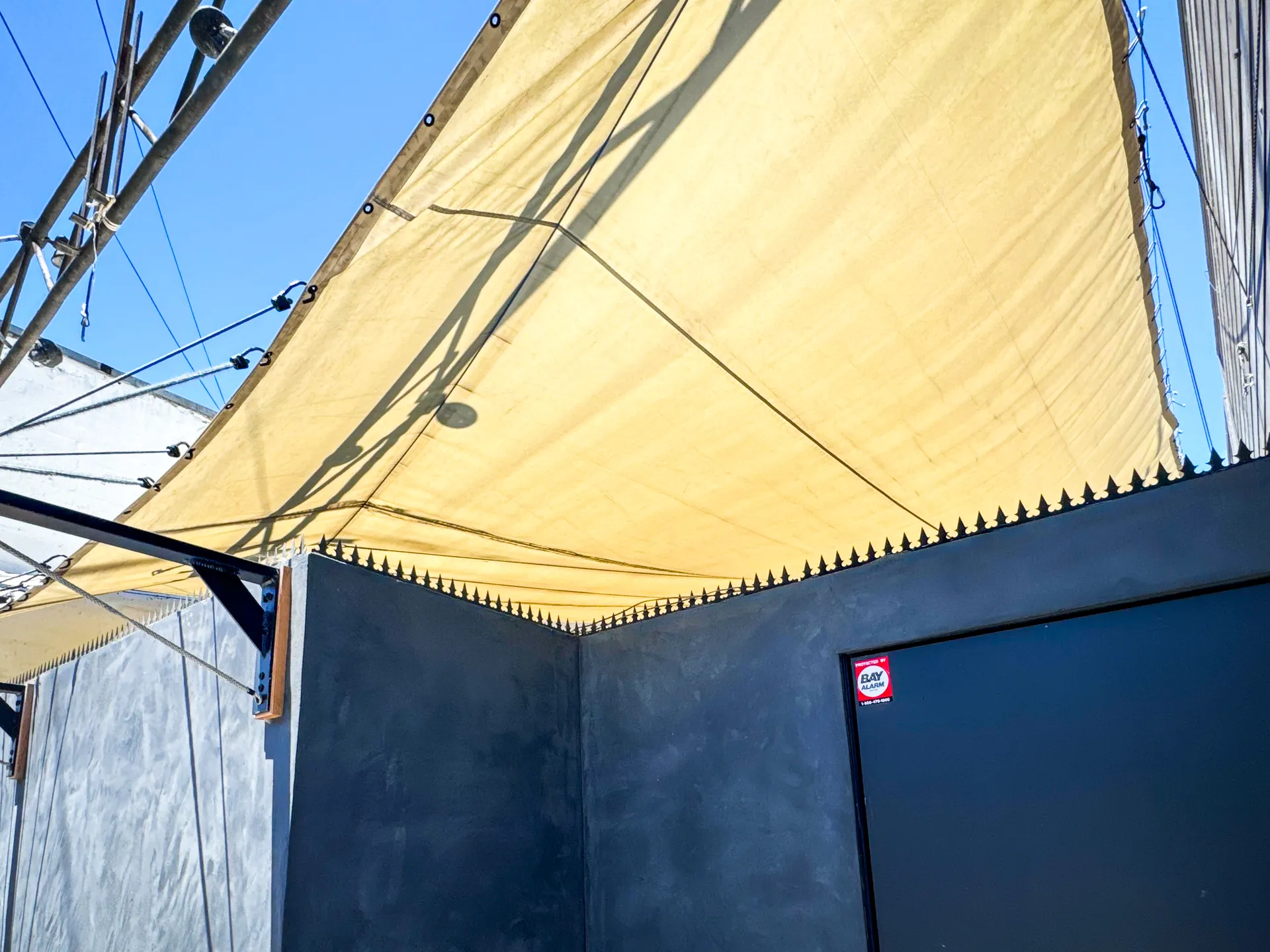 Detail of the serrated Modern series blade line against the blue sky