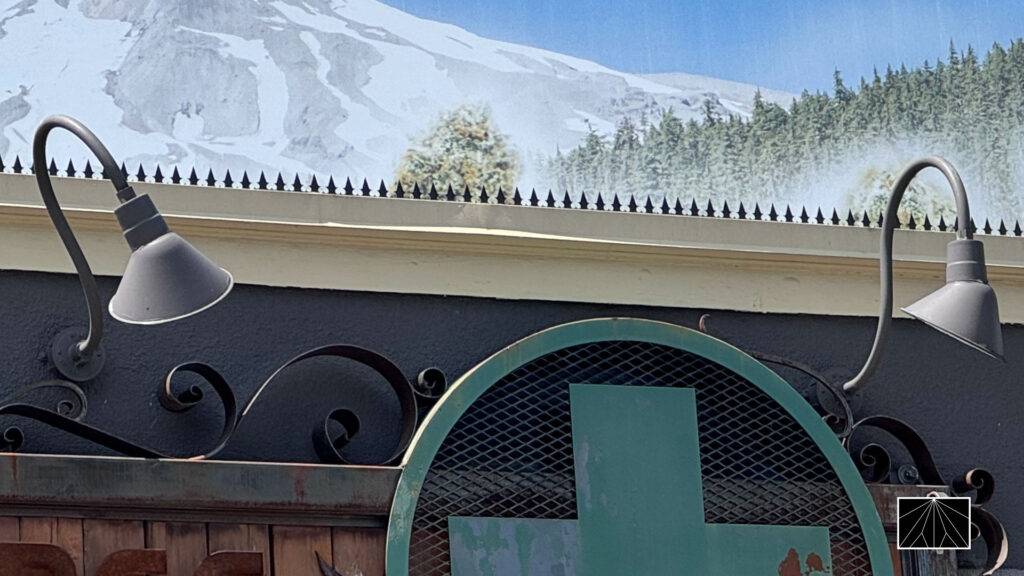 Tree House Collective entrance with rooftop billboard and security spikes along the roofline