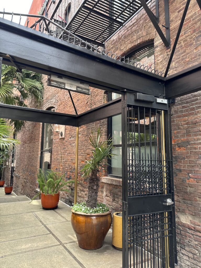 Ninja Deterrent™ spikes on café beam integrated with steel and brick