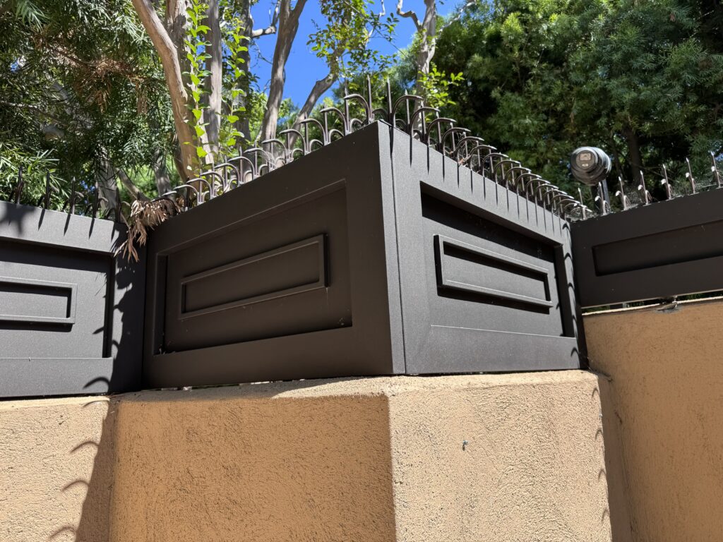 Fence corner detail showing Classic Short Dual (Black) spikes continuing across the top with no gaps